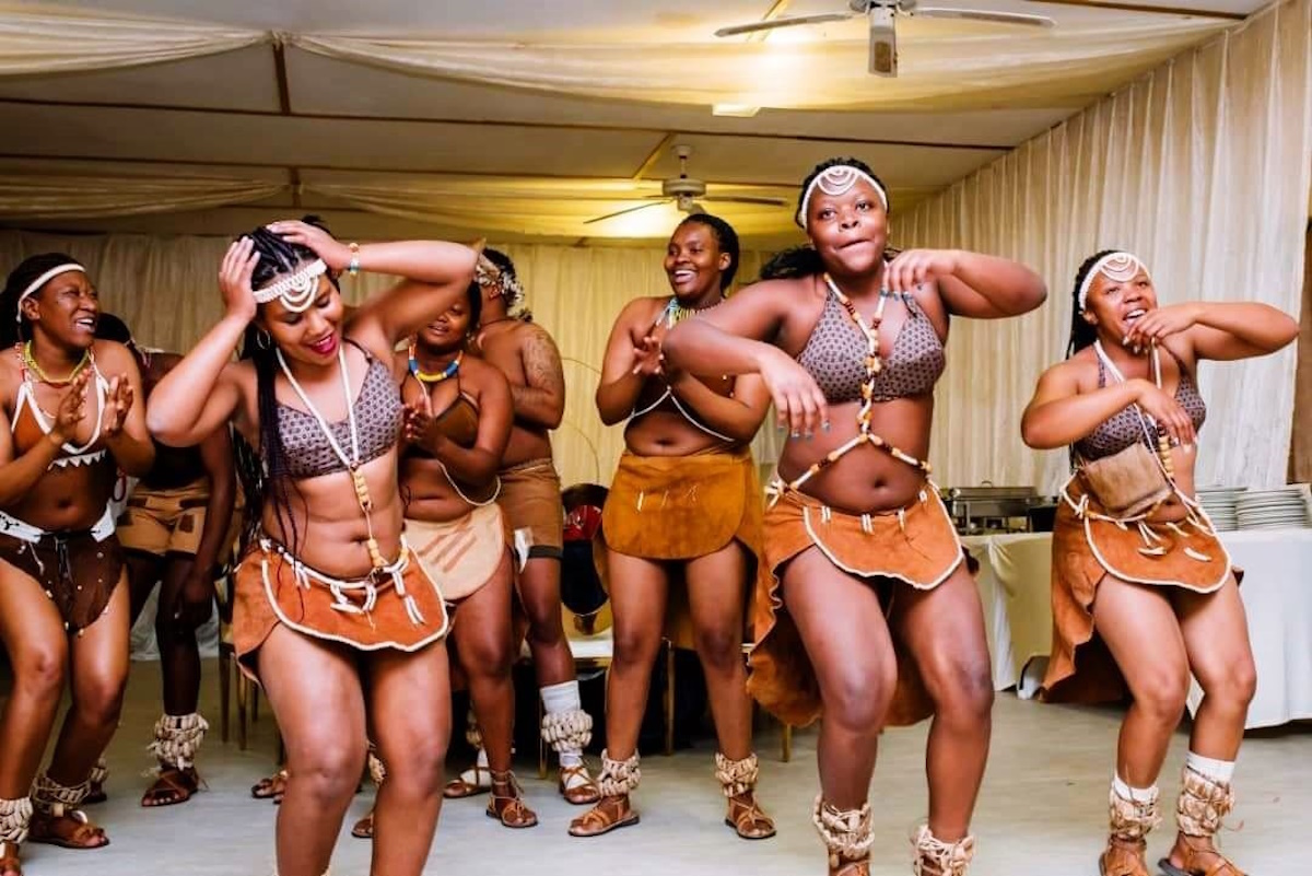 Botswana dancers in traditional costumes performing a cultural dance