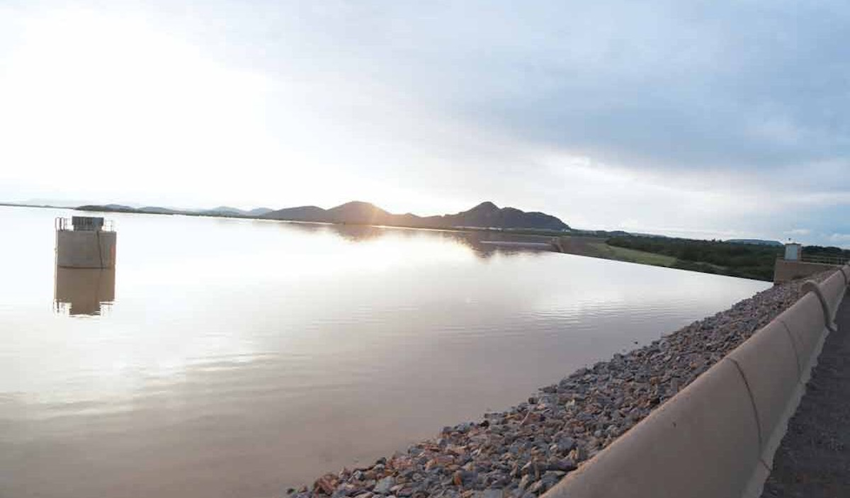 Scenic view of Gaborone Dam surrounded by lush vegetation